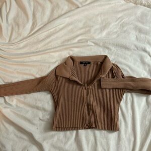 A cute collared long sleeve with a zipper in the front.